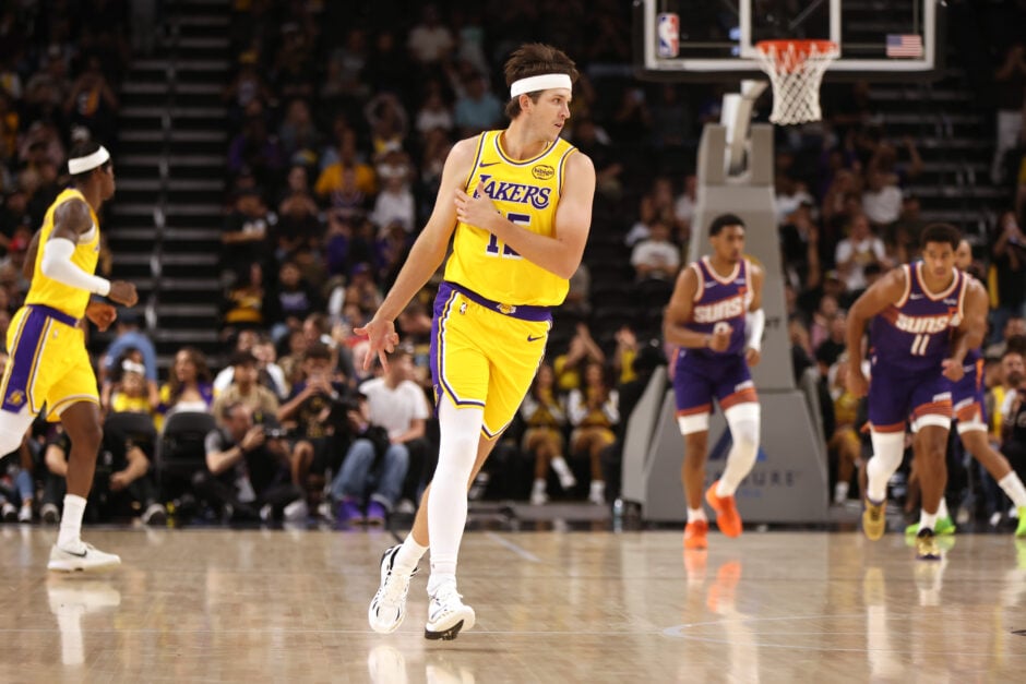 Austin Reaves #15 of the Los Angeles Lakers reacts after hitting a three point basket in the first half of a game against the Phoenix Suns at Acrisure Arena.
