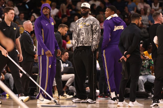 Lakers forwards Jarred Vanderbilt, left, LeBron James, center, and Rui...