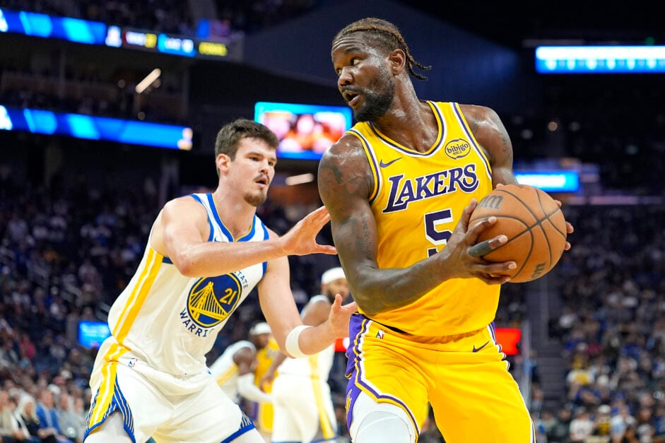 Deandre Ayton #5 of the Los Angeles Lakers backs in on Quinten Post #21 of the Golden State Warriors in the first half of a NBA preseason basketball game at Chase Center.