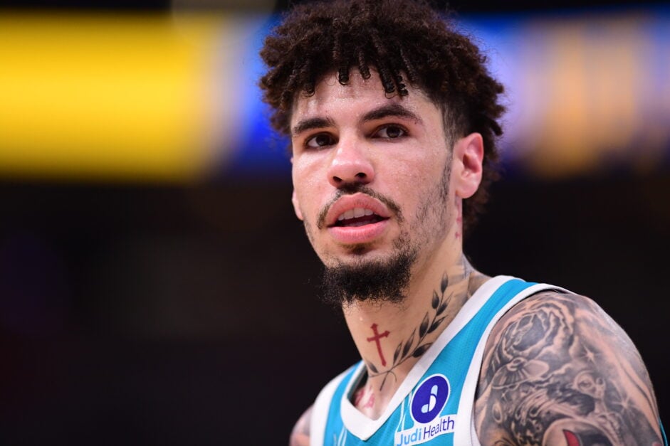 LaMelo Ball #1 of the Charlotte Hornets looks on during the second half of a preseason game against the Oklahoma City Thunder.