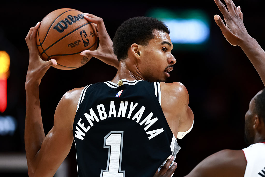 MIAMI, FLORIDA - OCTOBER 08: Victor Wembanyama #1 of the San Antonio Spurs controls the ball against the Miami Heat during the first half at Kaseya Center on October 08, 2025 in Miami, Florida. (Photo by Carmen Mandato/Getty Images)