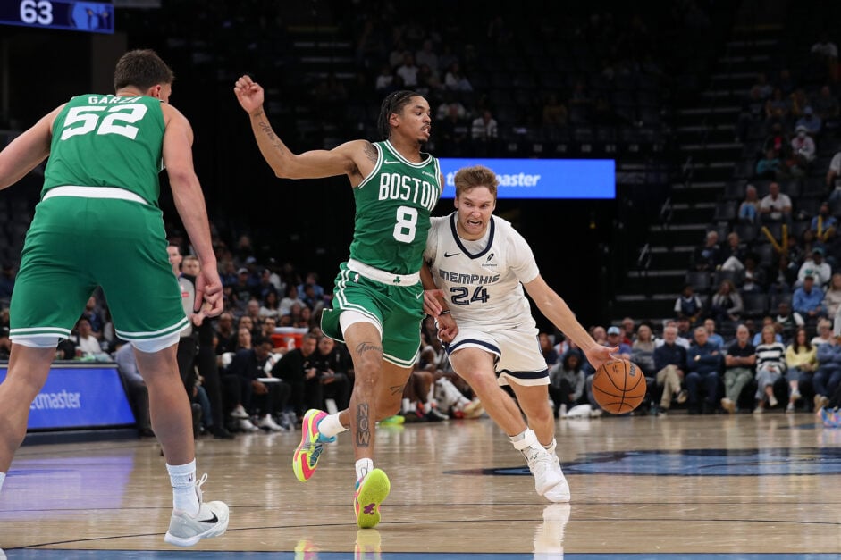 Cam Spencer #24 of the Memphis Grizzlies drives to the basket against Josh Minott #8 of the Boston Celtics during the second half of a preseason game at FedExForum on October 08, 2025 in Memphis, Tennessee.
