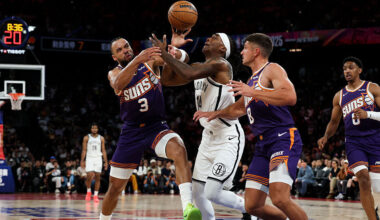 Terance Mann #14 of Brooklyn Nets competes with Dillon Brooks #3 of Phoenix Suns during NBA China G...
