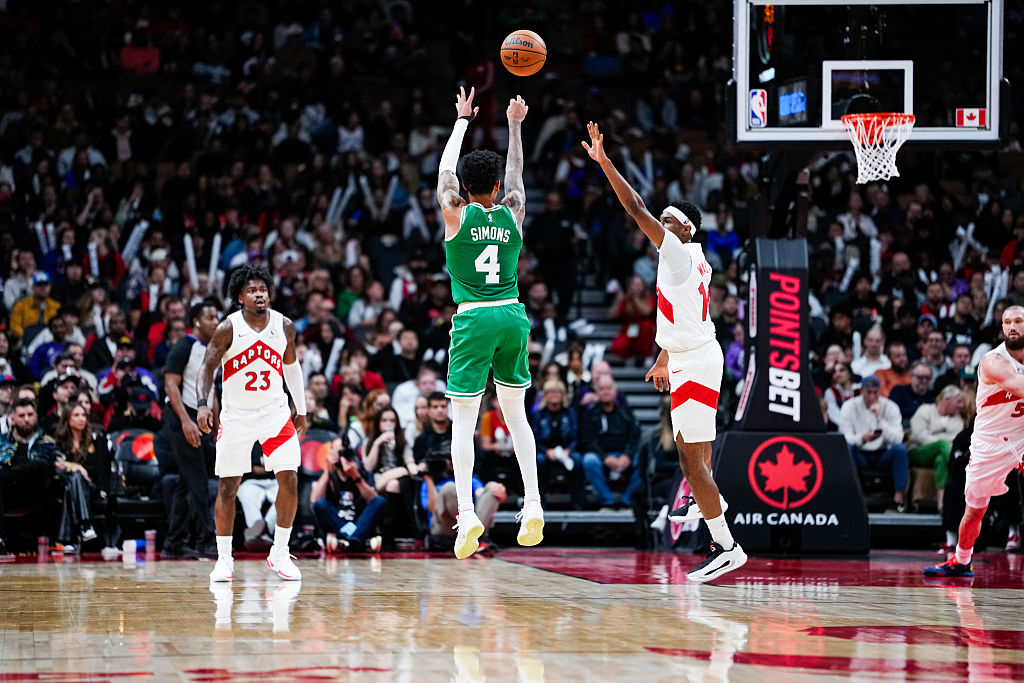 TORONTO, CANADA - OCTOBER 10: Anfernee Simons #4 of the Boston Celtics shoots against the Toronto Raptors during the second half of their pre-season basketball game at the Scotiabank Arena on October 10, 2025 in Toronto, Ontario, Canada. NOTE TO USER: User expressly acknowledges and agrees that, by downloading and/or using this Photograph, user is consenting to the terms and conditions of the Getty Images License Agreement. (Photo by Mark Blinch/Getty Images)