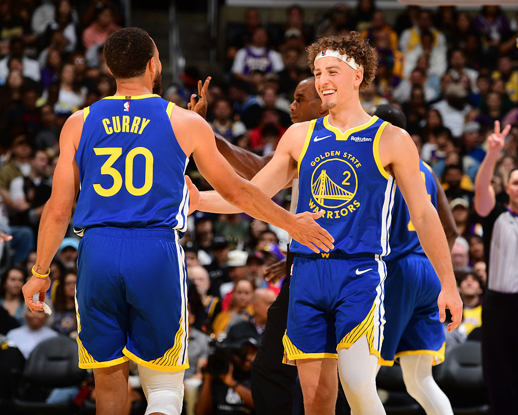 LOS ANGELES, CA - OCTOBER 21: Stephen Curry #30 high fives Brandin Podziemski #2 of the Golden State Warriors during the game against the Los Angeles Lakers on October 21, 2025 at Crypto.Com Arena in Los Angeles, California. NOTE TO USER: User expressly acknowledges and agrees that, by downloading and/or using this Photograph, user is consenting to the terms and conditions of the Getty Images License Agreement. Mandatory Copyright Notice: Copyright 2025 NBAE (Photo by Adam Pantozzi/NBAE via Getty Images)