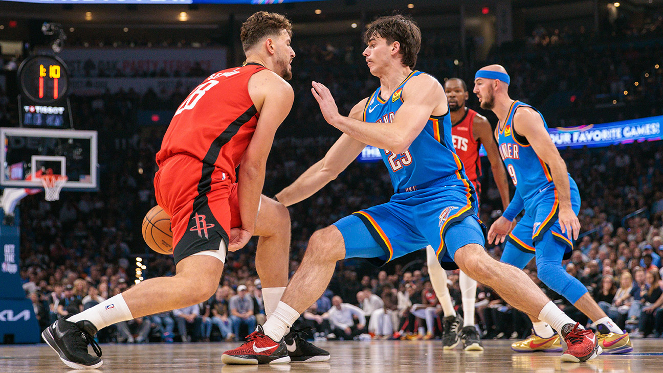 Brooks Barnhizer 23 of the Oklahoma City Thunder guards Alperen Sengun 28 of the Houston Rockets during the first half at Paycom Center on October 21, 2025 in Oklahoma City, Oklahoma.