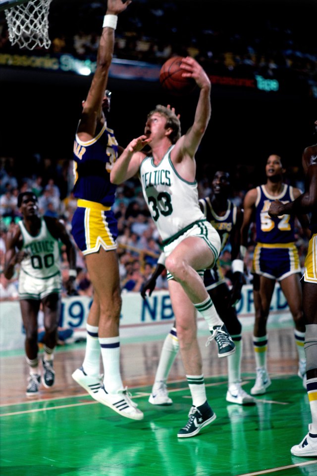 BOSTON - JUNE 12:  Larry Bird #33 of the Boston Celtics goes up for a shot against Kareem Abdul Jabbar #33 of the Los Angeles Lakers during Game Seven of the 1984 NBA Finals played on June 12 at the Boston Garden in Boston, Massachusetts. The Boston Celtics defeated the Los Angeles Lakers 111-102 and won the series 4-3 to capture the 1984 NBA Championship. NOTE TO USER: User expressly acknowledges that, by downloading and or using this photograph, User is consenting to the terms and conditions of the Getty Images License agreement. Mandatory Copyright Notice: Copyright 1984 NBAE (Photo by Dick Raphael/NBAE via Getty Images)