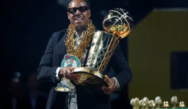 Former Boston Celtic Paul Pierce carries the Larry O’Brien Championship trophy during the NBA championship banner raising at TD Garden on Oct. 22, 2024.