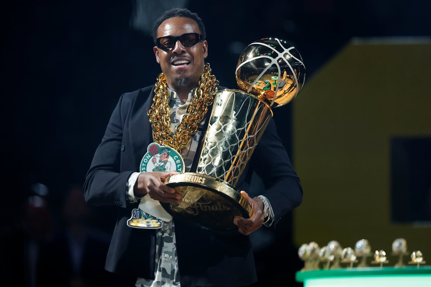 Former Boston Celtic Paul Pierce carries the Larry O’Brien Championship trophy during the NBA championship banner raising at TD Garden on Oct. 22, 2024.