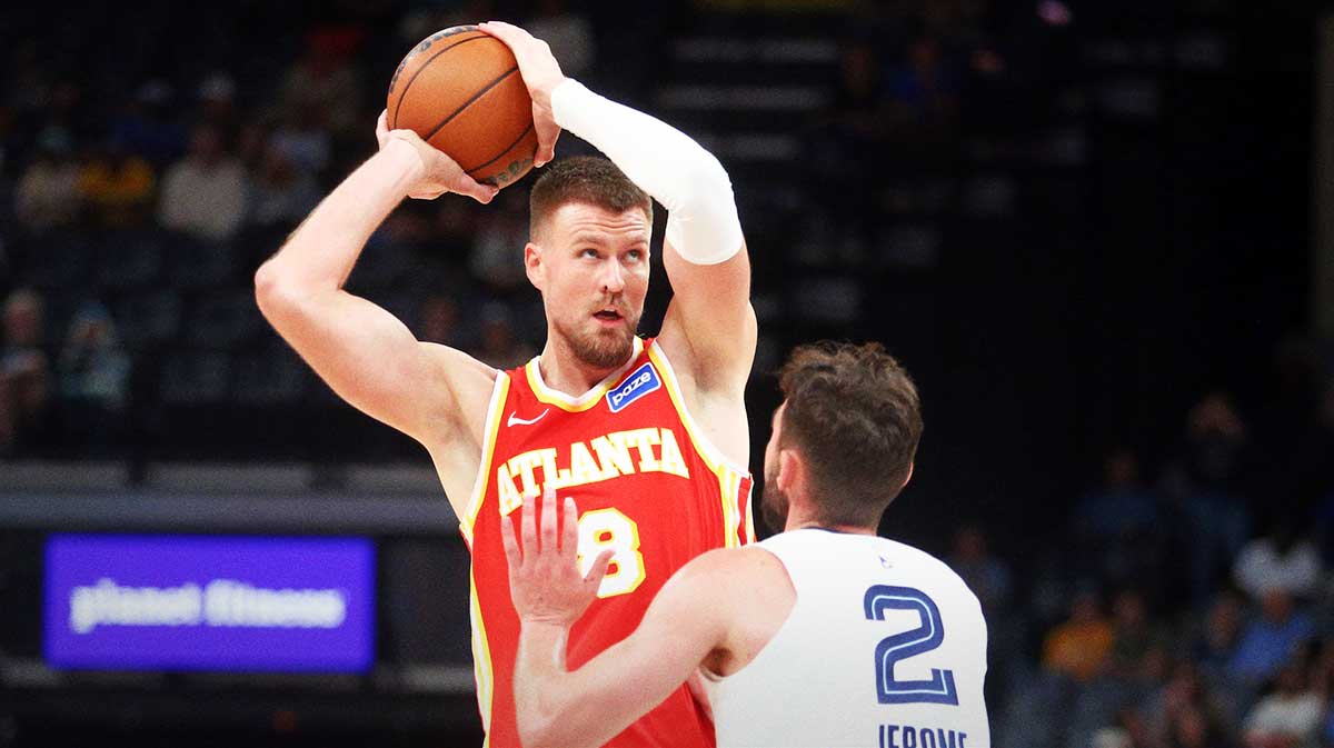 Atlanta Hawks center Kristaps Porzingis (8) handles the ball as Memphis Grizzlies guard Ty Jerome (2) defends during the second quarter at FedExForum.