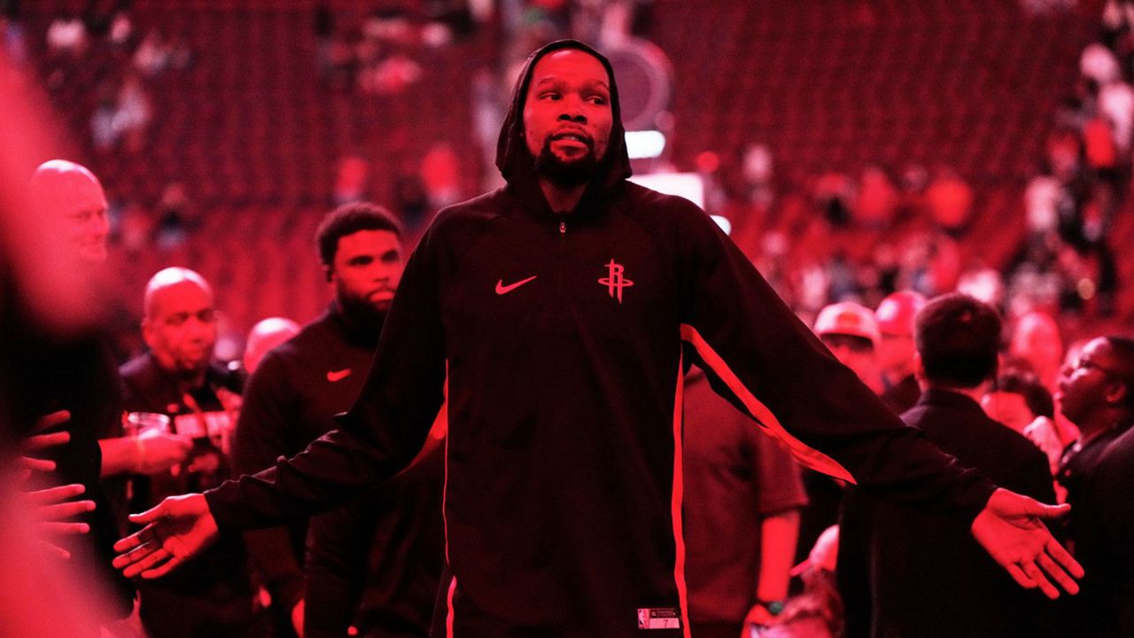 Houston Rockets forward Kevin Durant (7) leaves the court after an NBA basketball preseason game against the Utah Jazz in Houston, Wednesday, Oct. 8, 2025. (AP Photo/Ashley Landis)