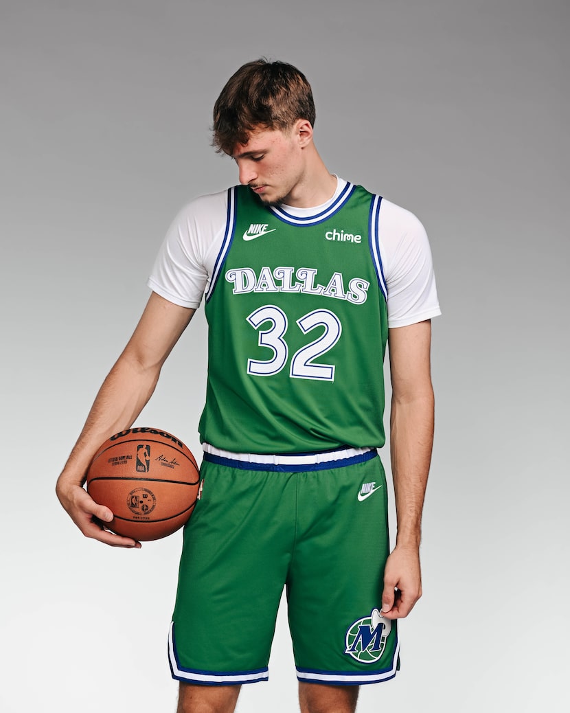 Cooper Flagg wears Dallas Mavericks 2025 Hardwood Classic uniforms at media day on Monday,...