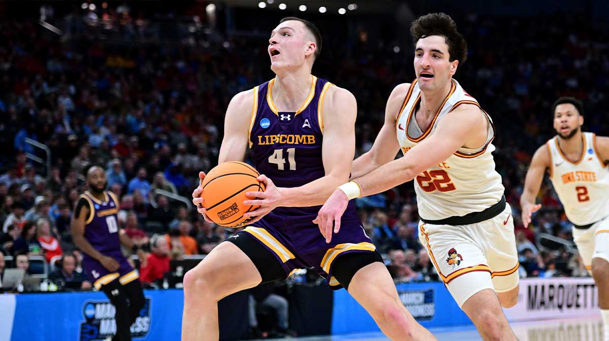Lipscomb Bisons forward Jacob Ognacevic (41) drives against Iowa State Cyclones forward Milan Momcilovic (22) during the second half of a first round NCAA men’s tournament game at Fiserv Forum.