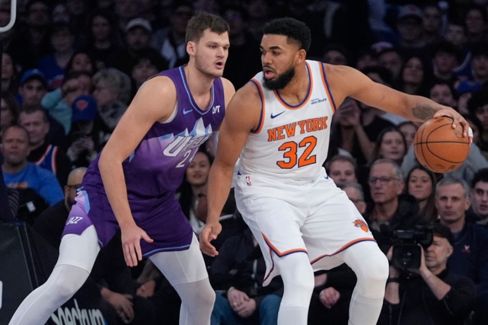 Utah Jazz's Walker Kessler (24) defends New York Knicks' Karl-Anthony Towns (32) during the first half of an NBA basketball game Wednesday, Jan. 1, 2025, in New York. (AP Photo/Frank Franklin II)