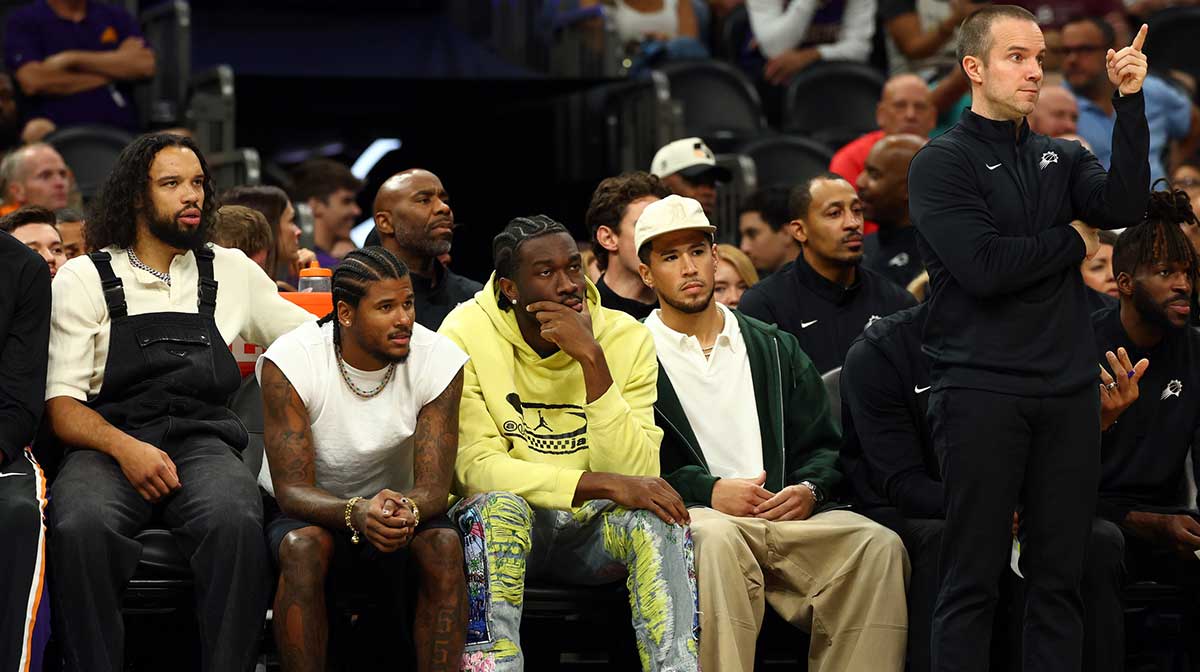 Phoenix Suns players (from left) Dillon Brooks, Jalen Green, Mark Williams, Devin Booker and head coach Jordan Ott against the Los Angeles Lakers during an NBA preseason game at Mortgage Matchup Center.