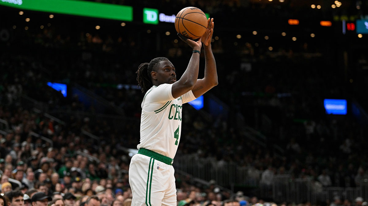Boston Celtics guard Jrue Holiday (4) shoots the ball against the Charlotte Hornets in the first half at TD Garden.