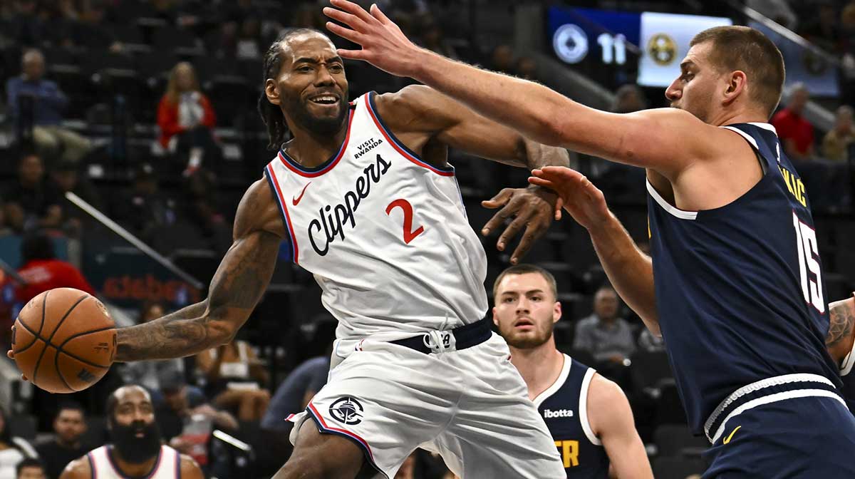 Los Angeles Clippers forward Kawhi Leonard (2) passes the ball against Denver Nuggets center Nikola Jokić (15) during the first quarter at Intuit Dome.