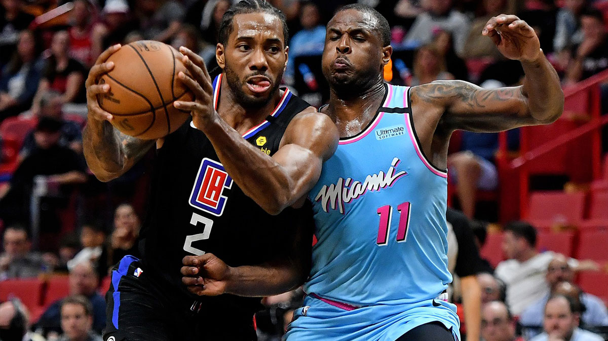 LA Clippers forward Kawhi Leonard (2) drives the ball around Miami Heat guard Dion Waiters (11) during the second half at American Airlines Arena.