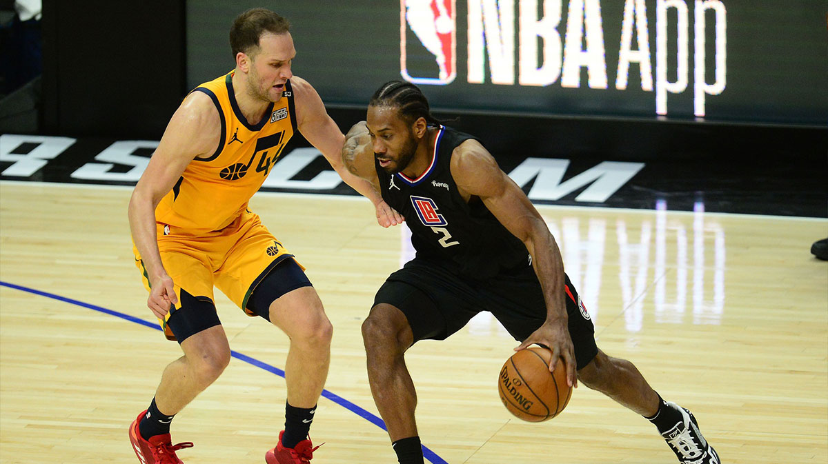 Los Angeles Clippers forward Kawhi Leonard (2) moves the ball against Utah Jazz forward Bojan Bogdanovic (44) during the second half in game four in the second round of the 2021 NBA Playoffs. at Staples Center.