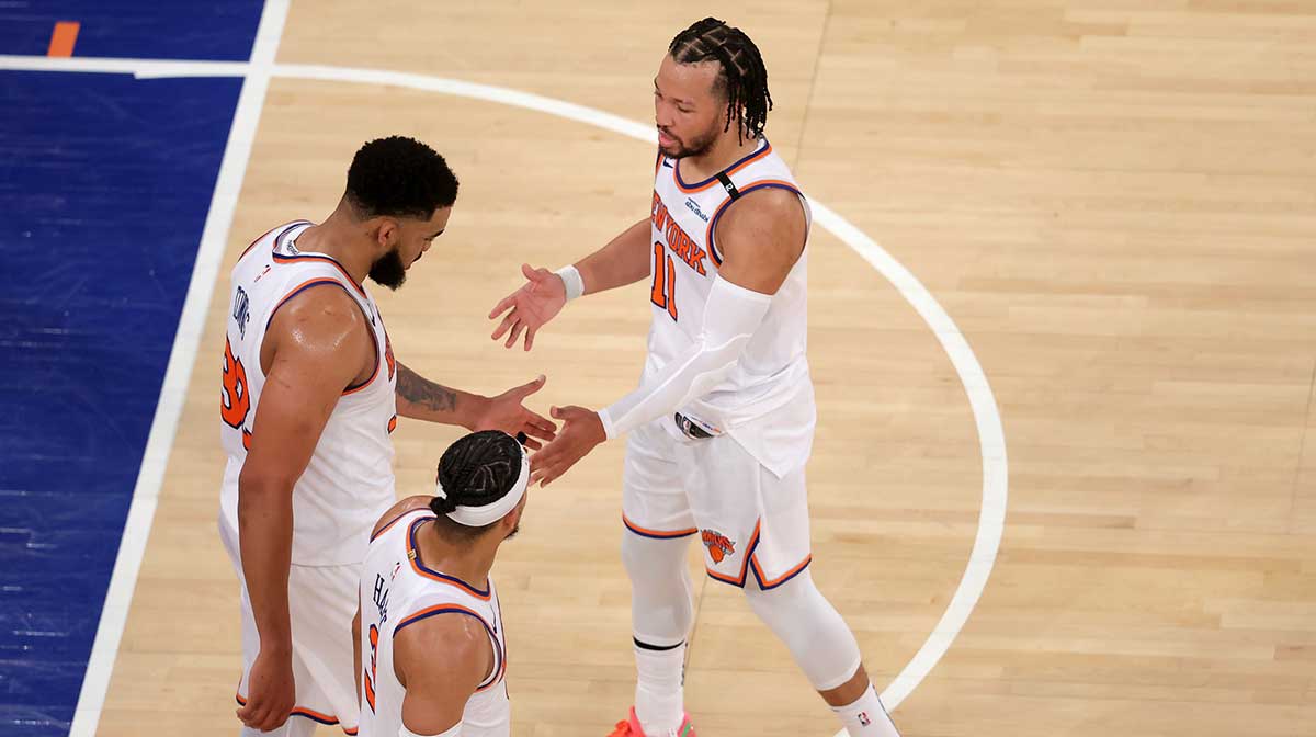 Knicks guard Jalen Brunson (11) and center Karl-Anthony Towns (32) and guard Josh Hart (3) react in the fourth quarter against the Indiana Pacers during game five of the eastern conference finals for the 2025 NBA Playoffs at Madison Square Garden