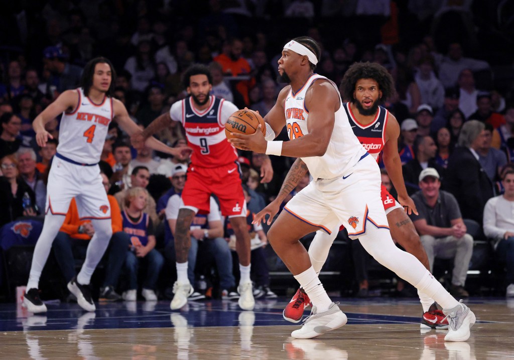 Guerschon Yabusele with the ball looking to pass during a preseason game.