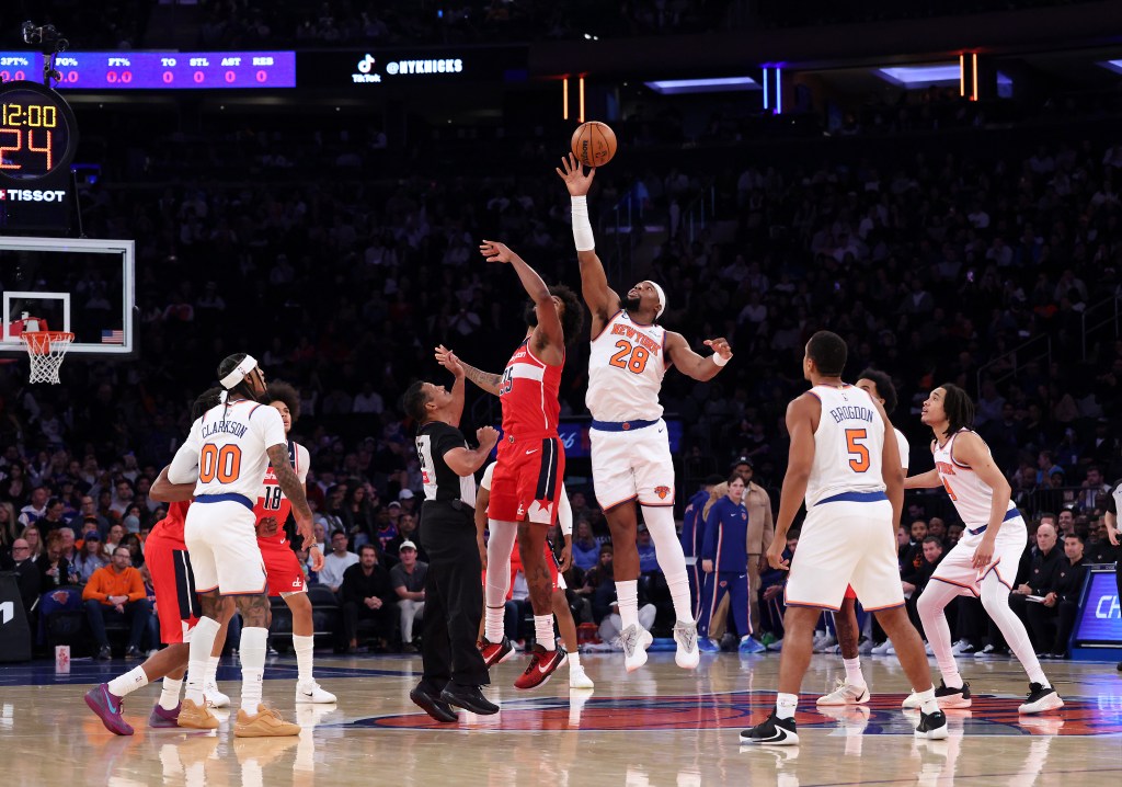 Guerschon Yabusele wins the opening tip of Monday night's preseason game against the Wizards.