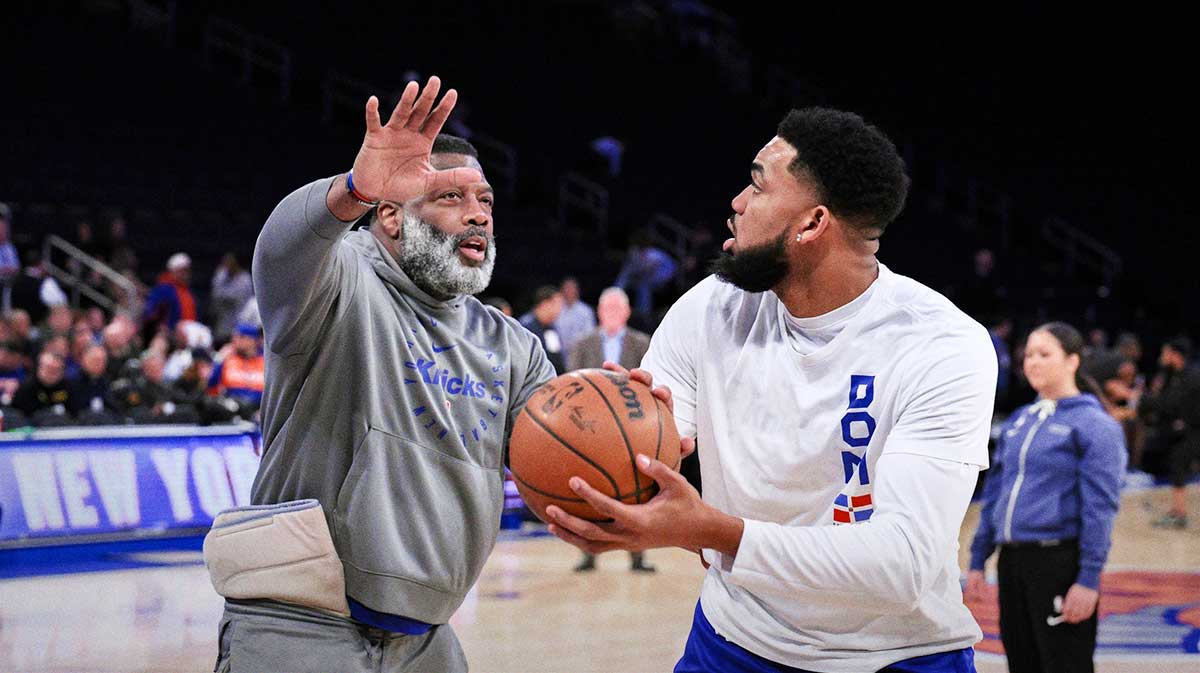 Apr 8, 2025; New York, New York, USA; New York Knicks center Karl-Anthony Towns (right) warms up with assistant coach Mark Bryant before a game against the Boston Celtics at Madison Square Garden. Mandatory Credit: John Jones-Imagn Images