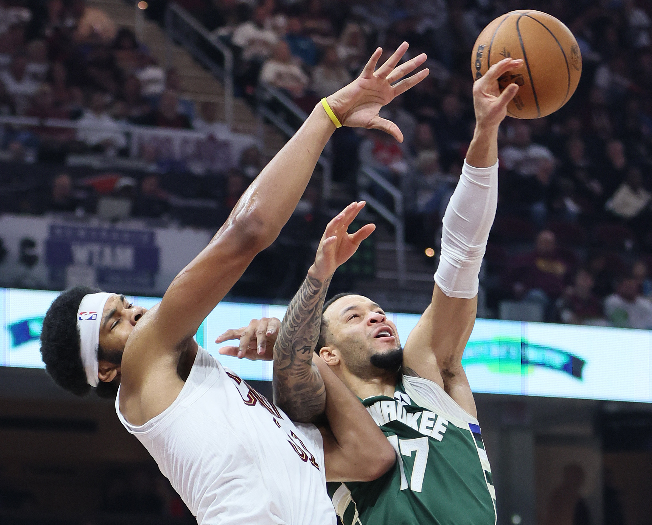 Milwaukee Bucks guard Amir Coffey (R) deflects a pass intended for Cleveland Cavaliers center Jarrett Allen in the first half at Rocket Arena. 
