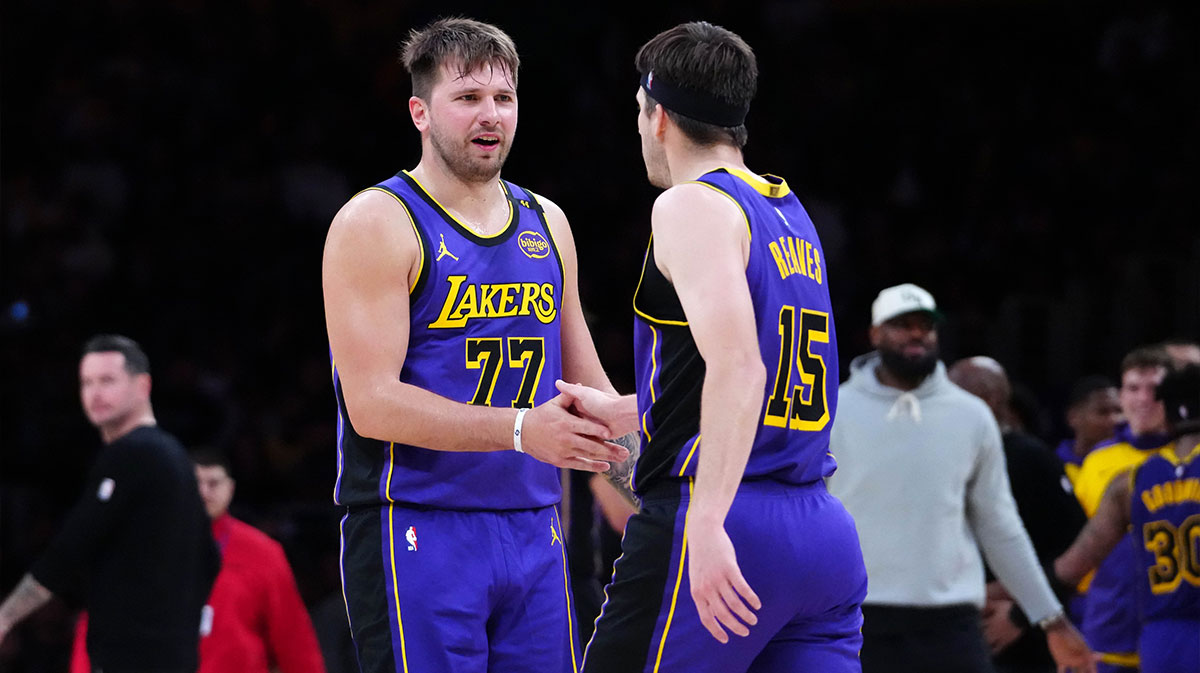 Lakers guard Luka Doncic (77) and guard Austin Reaves (15) react against the San Antonio Spurs in the first half at Crypto.com Arena