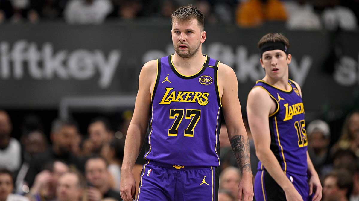 Los Angeles Lakers guard Luka Doncic (77) and guard Austin Reaves (15) during the game between the Dallas Mavericks and the Los Angeles Lakers at American Airlines Center.