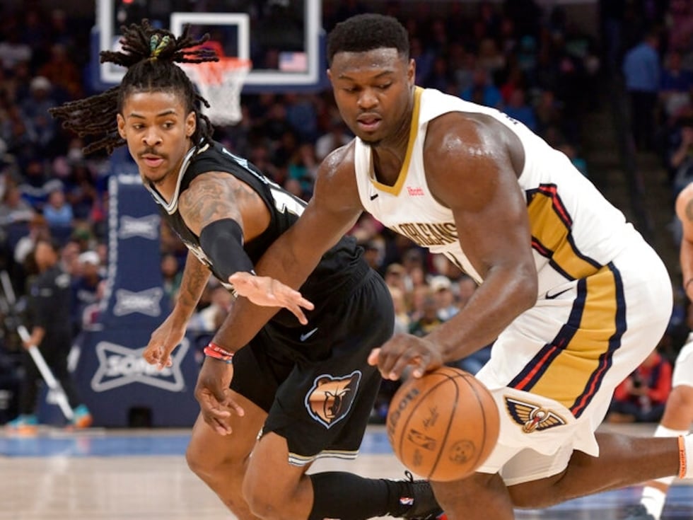 New Orleans Pelicans forward Zion Williamson (1) handles the ball against Memphis Grizzlies...
