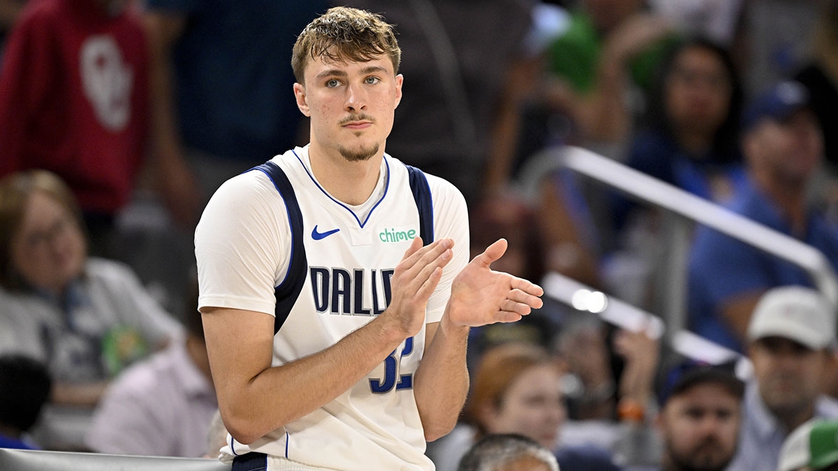 Mavericks forward Cooper Flagg (32) looks on