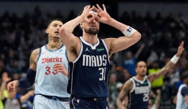 Dallas Mavericks guard Klay Thompson (31) gestures after scoring a 3-point basket against Washington Wizards forward Kyle Kuzma, left, during the first half of an NBA basketball game Monday, Jan. 27, 2025, in Dallas. (AP Photo/LM Otero)