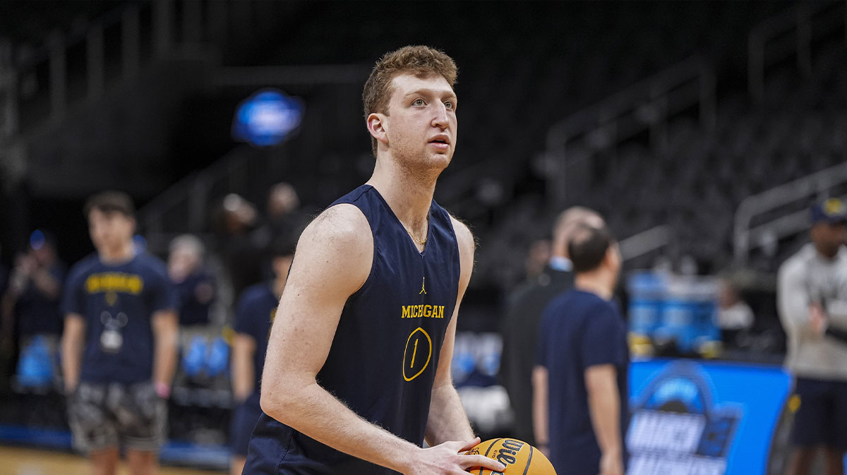 Michigan Wolverines center Danny Wolf (1) shoots on the court during practice at State Farm Arena.