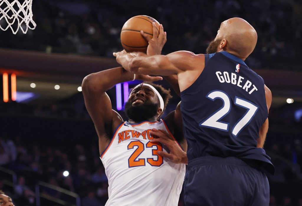 MItchell Robinson looks to shoot over Rudy Gobert during the Knicks' preseason win over the Timberwolves on Oct. 9 2025.