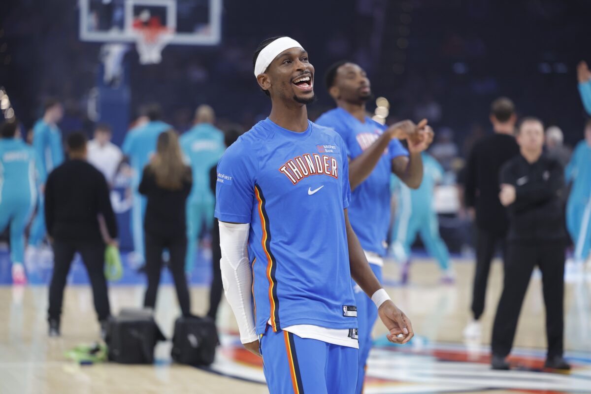 Oklahoma City Thunder guard Shai Gilgeous-Alexander smiles during warm ups before a game between the Charlotte Hornets and the Oklahoma City Thunder at Paycom Center.