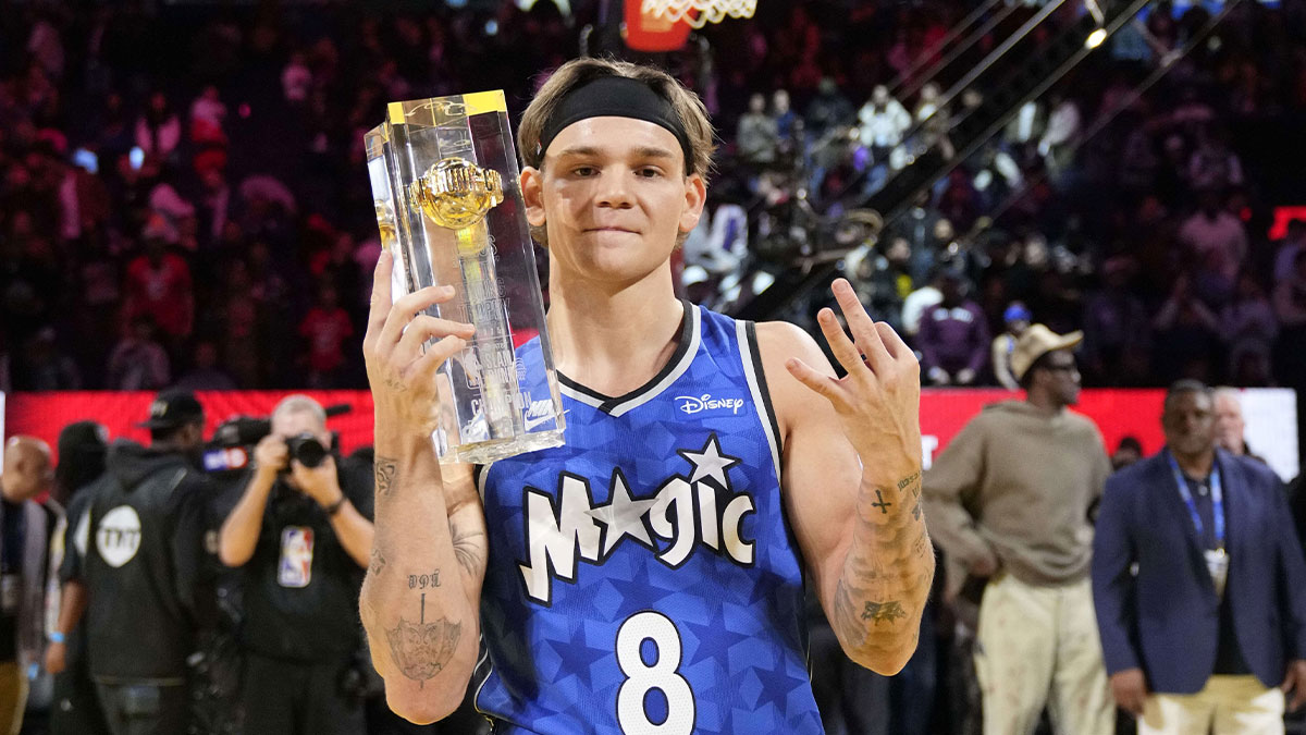 Pacers guard Mac McClung celebrates with the trophy after winning the slam dunk competition during All Star Saturday Night ahead of the 2025 NBA All Star Game at Chase Center with James Wiseman in the background