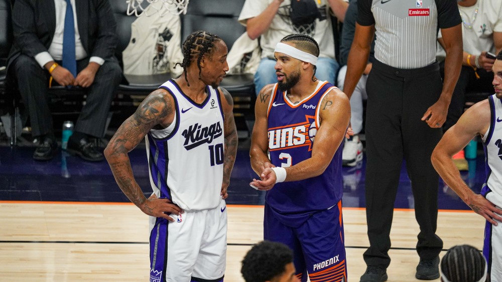 Phoenix Suns forward Dillon Brooks talks to Sacramento Kings forward Demar DeRozan (Jeremy Schnell/...