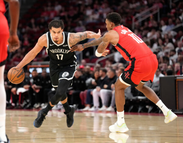 Brooklyn Nets forward Michael Porter Jr. (17) controls the ball against Houston Rockets forward Jabari Smith Jr. (10) during the first half of an NBA basketball game, Monday, Oct. 27, 2025, in Houston. (AP Photo/Karen Warren)