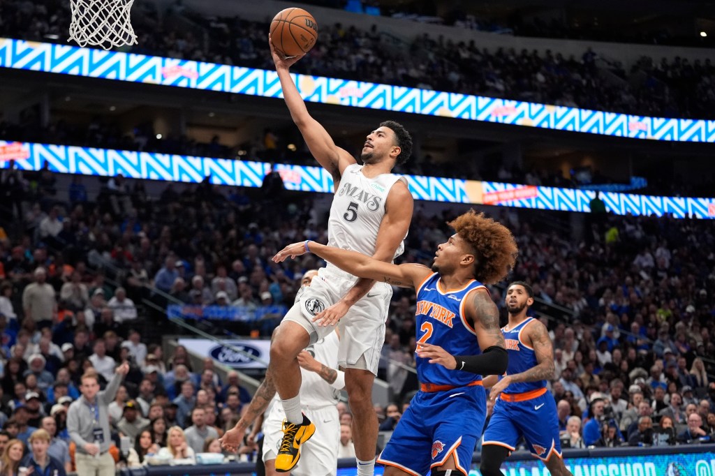 Quentin Grimes drives past Miles McBride for a layup during the Knicks' loss to the Mavericks. 