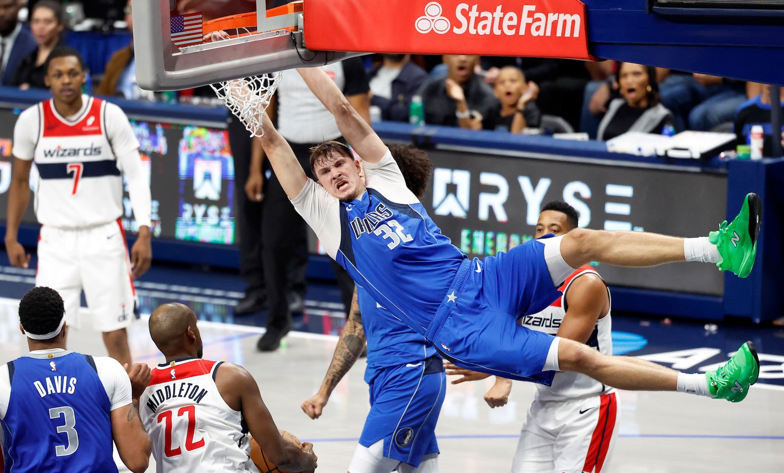 Dallas Mavericks forward Cooper Flagg (32) throws down a fourth quarter dunk against the...