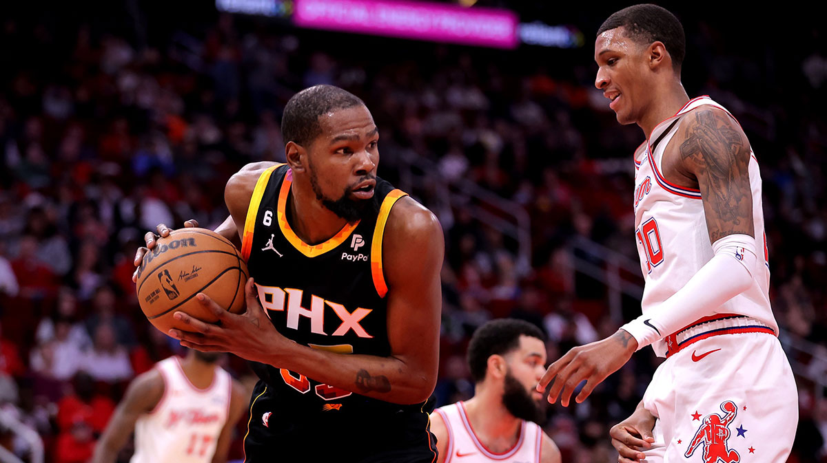 hoenix Suns forward Kevin Durant (35) rebounds against Houston Rockets forward Jabari Smith Jr. (10) during the first quarter at Toyota Center.