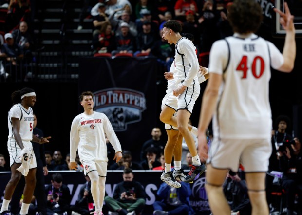 San Diego State's Miles Byrd celebrates after making a three pointer against Boise State during the quarterfinal of the Mountain West Conference Tournament in Las Vegas on Thursday, March 13, 2025. (K.C. Alfred / The San Diego Union-Tribune)