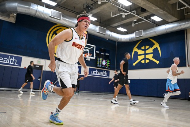 Altitude's Vic Lombardi lets the fans know that he is him after knocking down a 3-pointer during a scrimmage between the Denver Nuggets coaching staff and local media members at Ball Arena on Tuesday, Oct. 21, 2025. The coaches escaped the practice facility by way of a thrilling 114-16 win. (Photo by AAron Ontiveroz/The Denver Post)