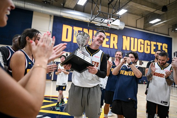 Zach Bye smiles as he is named media MVP after a scrimmage between the Denver Nuggets coaching staff and local media members at Ball Arena on Tuesday, Oct. 21, 2025. The coaches escaped the practice facility by way of a thrilling 114-16 win. (Photo by AAron Ontiveroz/The Denver Post)