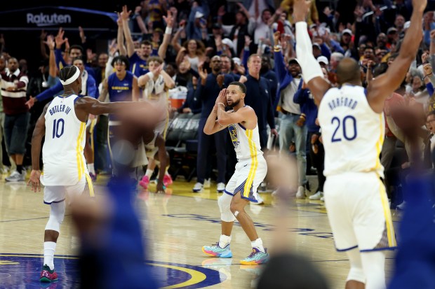Stephen Curry of the Golden State Warriors does his "night night" celebration after Jimmy Butler III #10 made a three-point basket against the Denver Nuggets in overtime at Chase Center on Oct. 23, 2025 in San Francisco, California. (Photo by Ezra Shaw/Getty Images)