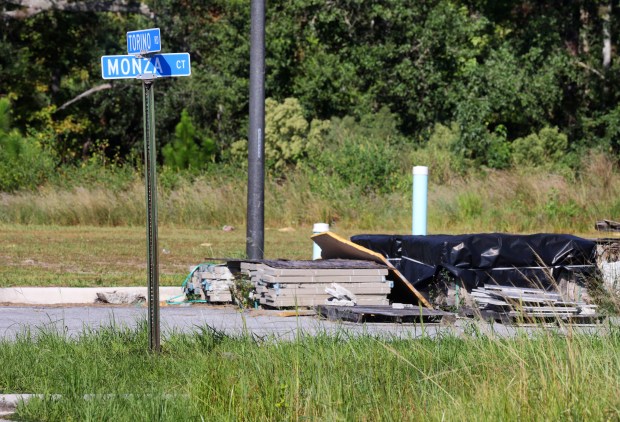 Building materials sit at the intersection of Torino Road and...