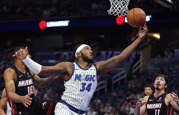 Orlando center Wendell Carter Jr. (34) pulls in a rebound...