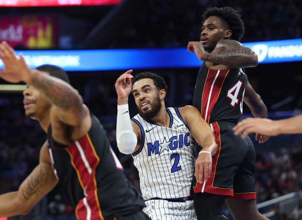 Orlando guard Tyus Jones (2) battles for position during the...