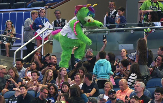 Stuff the Magic mascot has fun with fans during the...
